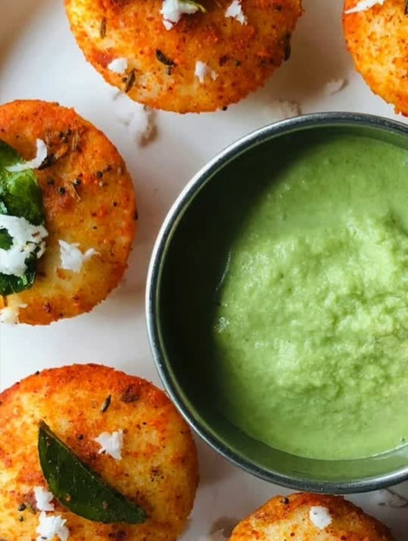 Golden fried aloo tikki potato patties seasoned with herbs and spices